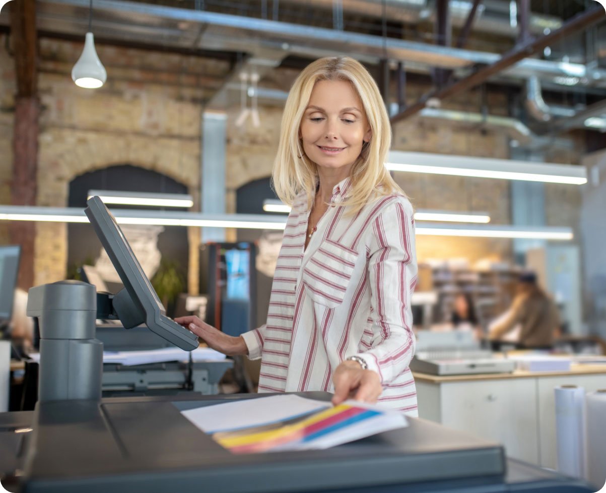 blonde-woman-choosing-paper-printing-settings-sel-2023-11-27-05-01-37-utc2