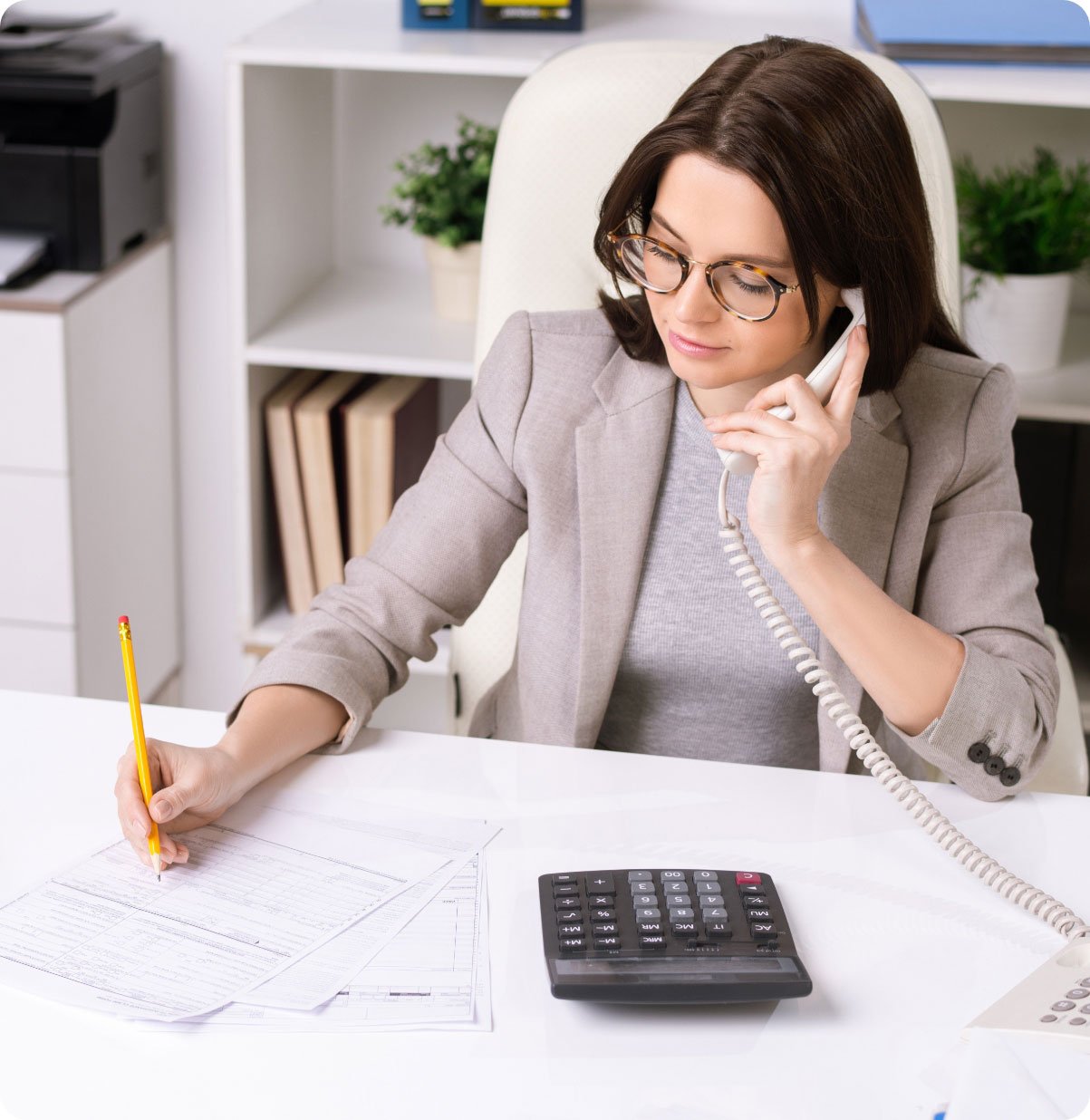 elegant-businesswoman-sitting-by-desk-in-office-c-2023-11-27-05-19-00-utc2
