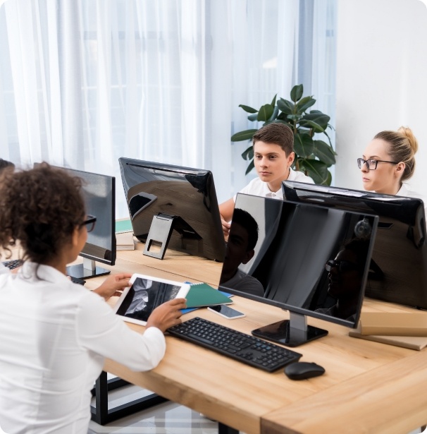 four-young-multicultural-students-studying-on-comp-2023-11-27-05-11-38-utc