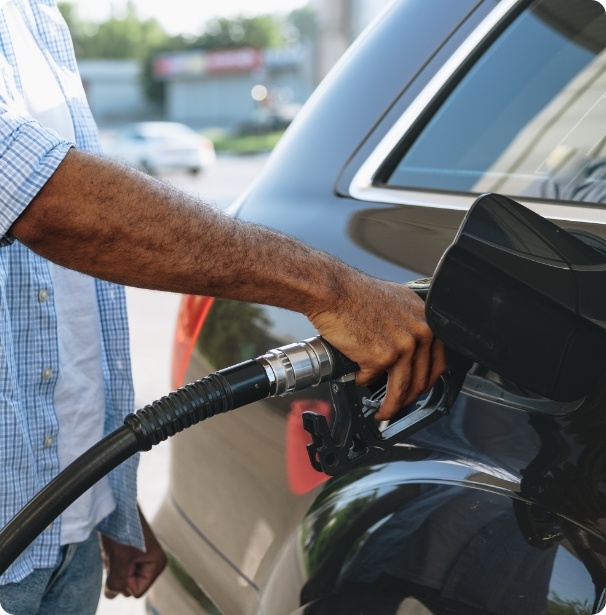 man-filling-gasoline-fuel-in-car-at-gas-station-2023-11-27-05-35-05-utc